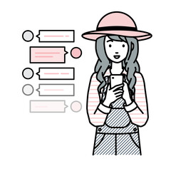 立ってスマートフォンで楽しくチャットで会話する農家の女性