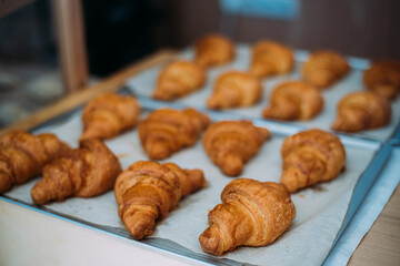 Fresh croissants, taken out of the oven, ready to eat