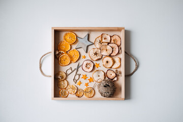 Eco friendly zero waste dried orange slices and DIY tools and stuff on the table. Handmade dried...