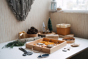Eco friendly zero waste dried orange slices and DIY tools and stuff on the table. Handmade dried...
