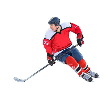 Professional ice hockey player on defending position on the rink. Isolated image on white