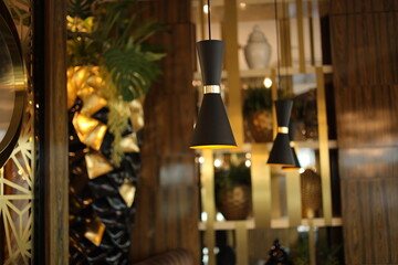 Beautiful interior in a restaurant or cafe. Dark light in the interior of an expensive restaurant. In quarantine and lockdown visiting a restaurant by QR code