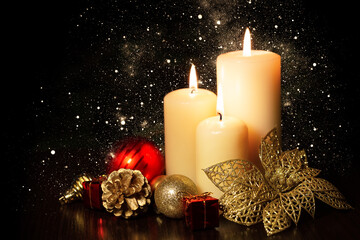 Christmas holiday card with  three burning candles and ornaments.