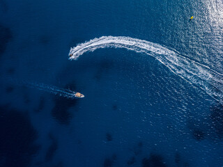 Aerial view on jetski and speed boat in tropical blue waters