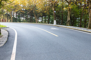 Fototapeta premium mountain road in autumn forest