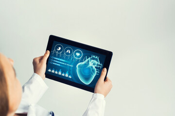 Close of female doctor hands working with tablet pc computer
