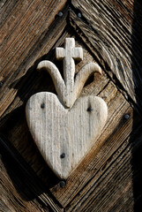 Wooden heart with a cross