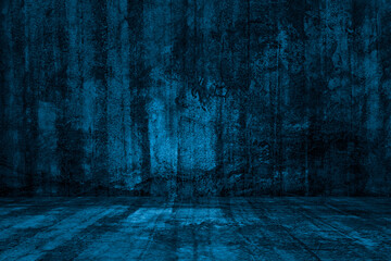 Empty dark blue abstract cement wall and studio room the interior texture of the old colorful wall with grain and scratches, Creative background for display products.