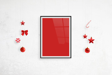 Hanging poster frame mockup surrounded by Christmas decorations. Blank poster frame for greeting text