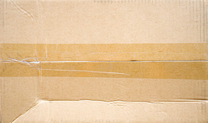 Brown paper box or Corrugated cardboard sheet with tape background