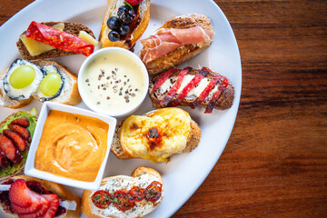 Traditional Spanish tapas on wooden table. Spanish tapas restaurant concept. Spanish food concept.