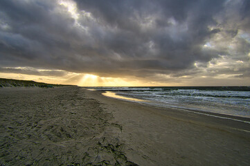 View over the dunes to the Baltic Sea at sunset