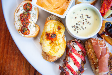 Traditional Spanish tapas on wooden table. Spanish tapas restaurant concept. Spanish food concept.