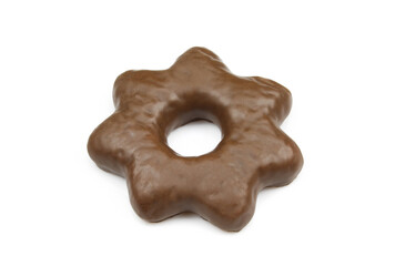 Single star shaped gingerbread biscuit covered in chocolate and isolated on white background