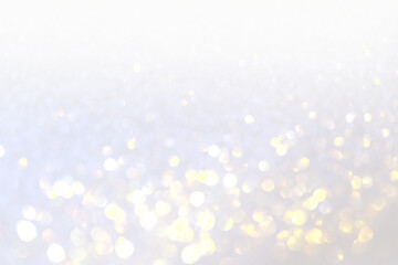 Silver, white and golden blur bokeh  in New Year eve and copy space. Abstract background holiday.