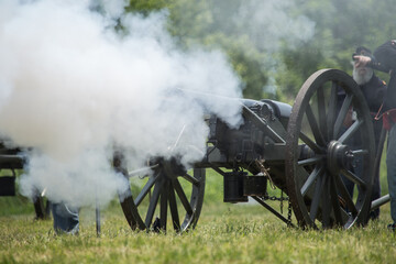 Smoke and military artillery during the daytime