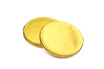 Chocolate sweets wrapped in yellow foil. Fake dessert coins 