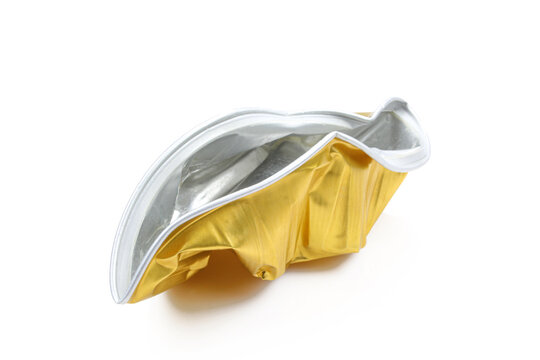 Crumpled food tin can isolated on white background