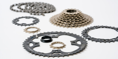 Gears, sprockets and chain of a mountain sports bike on a white background. Bicycle parts