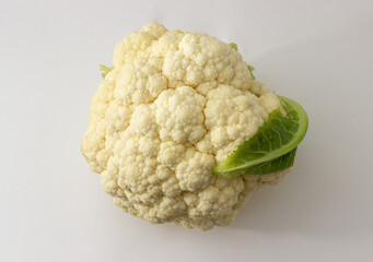 cauliflower with leaf on white background