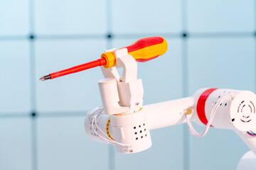 Robot hand with a screwdriver. The concept of automation of work on assembly lines