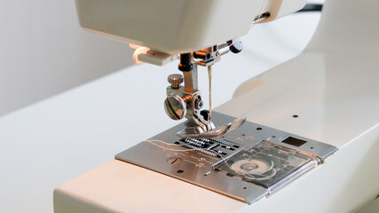 sewing machine foot and item of clothing
