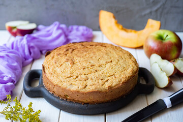Sweet pumpkin pie for tea on a white table. Close-up