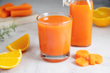 Orange and carrot juice, healthy smoothie. Healthy food, nutrition and diet concept