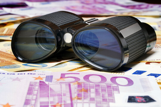 Black binoculars and euro. Currency Cash Money. Security. Discovery, telescope, binoculars. Detective. Forex. Finance expedition. Military. Vintage optic tool                        