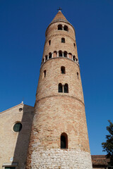 Fototapeta na wymiar the bell tower of cathedral Saint Stephen Protomartyr in the mediterranean town Caorle in the Adriatic Sea (North Italy)