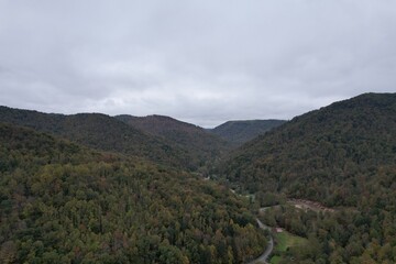 Fototapeta na wymiar Aerial drone view over the dense green autumn forests of the Appalachian Mountains in West Virginia 