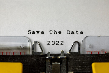 Save the date 2022 written on an old typewriter	