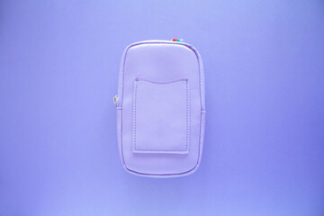 Purple small bag, top view bag isolated on purple background.