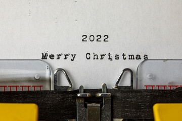 Merry Christmas 2022 written on an old typewriter	