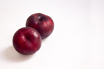 plums on white