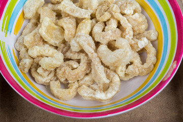 Colorful dish with crackling inside on top of a wooden desk