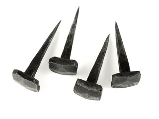 forged nails on a neutral background