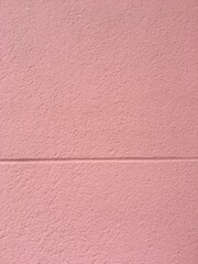 Textura de un viejo muro color rosado