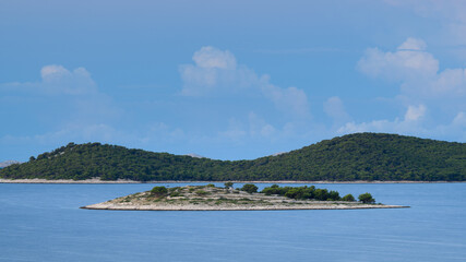 Fototapeta na wymiar Small island near Drage on a sunny day in summer
