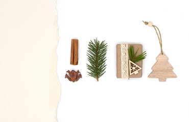 Fototapeta na wymiar christmas and New year flat lay, festive concept of pine branches and cones, christmas decorations and gifts on white background, top view with blank space