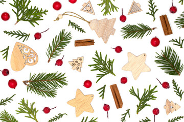 Festive concept new year and happy christmas flat lay of pine branches, christmas tree decorations, red berries and gifts on white background, top view