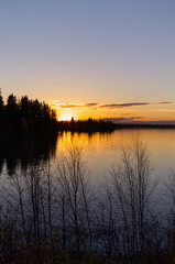 Fototapeta premium A Colourful Sunset at Astotin Lake, Elk Island National Park