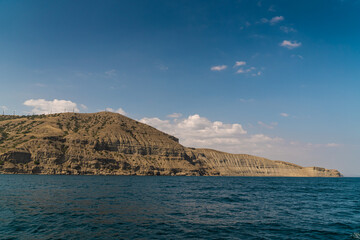 Obraz premium The Crimean Peninsula. July 21, 2021. Picturesque view of the coastline of Cape Meganom from the Black Sea.