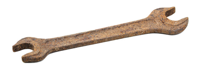 Old rusty wrench on a white background