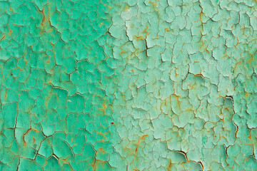 Old cracked green paint on rusty metal