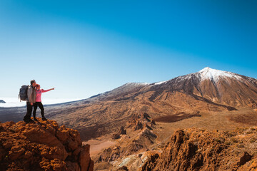 Fototapeta na wymiar sporty couple on top of mountain. Tenerife Canary