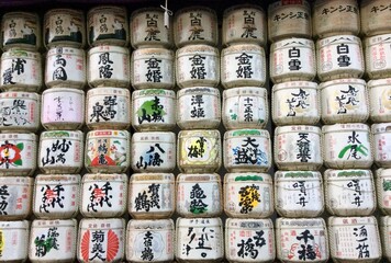 variety of japanese tea jars standing in stack. Vintage pattern, health