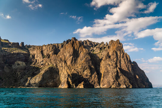 The Crimean Peninsula. July 21, 2021. Picturesque view of the high cliffs at Cape Karagach from the Black Sea.