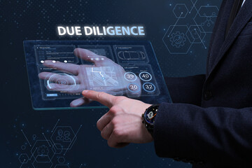 Business, Technology, Internet and network concept. Financial Graph. Stock Market chart. Young businessman working on a virtual screen of the future and sees the inscription: Due diligence