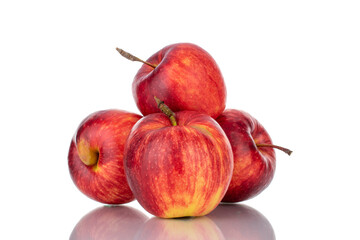Several juicy red apples, close-up isolated on white.